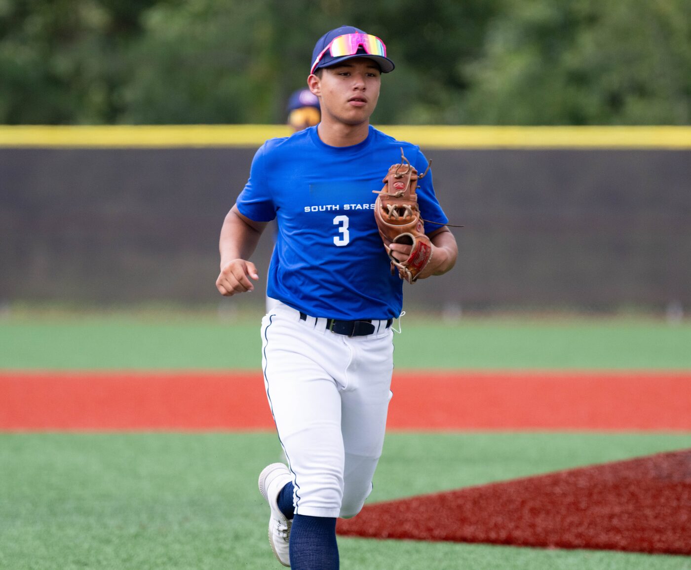 Drakon founder Ryan Canning tracking down a ball in Drakon sunglasses