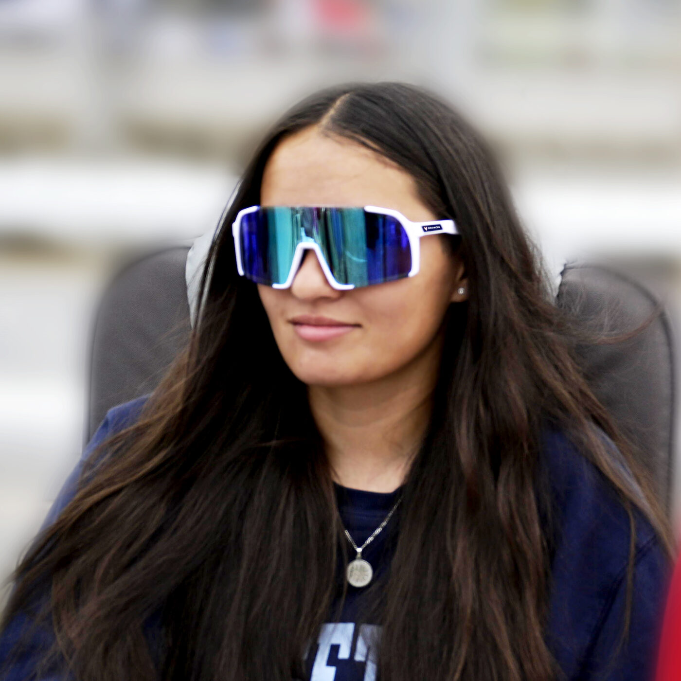 Athlete in Drakon pink performance sunglasses off the field